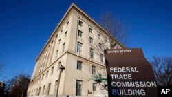 FILE - Signage marks the Federal Trade Commission building in Washington, Jan. 28, 2015.