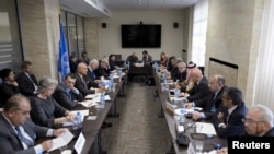 FILE - General view during a meeting between U.N. Syria envoy Staffan de Mistura and members of the Syrian interior opposition during Syria peace talks at the United Nations Office.