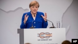 Kanselir Jerman Angela Merkel berbicara pada konferensi kemitraan G20-Afrika di Berlin, Jerman. 