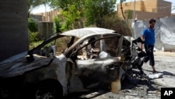 A man inspects the damage at his home after a bombing in Fallujah, 40 miles (65 kilometers) west of Baghdad, Iraq, May 24, 2016. Clashes between Iraqi forces and Islamic State militants have trapped countless civilians in the city.