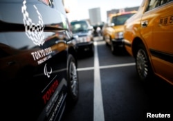 Mobil 'JPN Taxi' buatan Toyota Motor terparkir di pusat servis Hinomaru Kotsu Co. di Tokyo, Jepang, 14 Mei 2018.