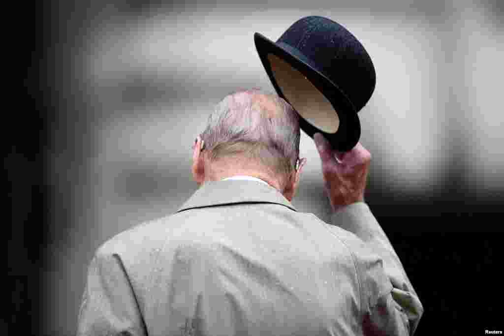 Britain's Prince Philip, in his role as Captain General, Royal Marines, attends a parade marking the finale of the 1664 Global Challenge, on the Buckingham Palace Forecourt, in London. The 96-year-old husband of Britain's Queen Elizabeth made his final solo appearance at the official engagement, before retiring from active public life.