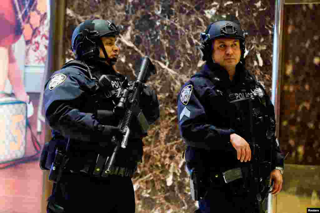 New York Police Department officers patrol inside Republican president-elect Donald Trump's Trump Tower in New York, Nov. 12, 2016. 