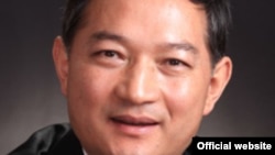 People stand on the edge of the crater to watch the eruption of Mount Bromo in Probolinggo, Indonesia.