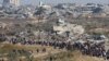 Palestinians, who were displaced to the south at Israel's order during the war, make their way back to their homes in northern Gaza, amid a ceasefire between Israel and Hamas, near Gaza City, Jan. 27, 2025. 