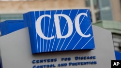 FILE - Signage for the Centers for Disease Control and Prevention is shown March 15, 2020, in Atlanta. The agency says 40 states reported high or very high levels of illness in the last full week of December 2024.