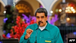 Presiden Venezuela Nicolas Maduro sedang berbicara di Istana Kepresidenan Miraflores di Caracas, pada 15 November 2020, di tengah pandemi Covid-19. (Foto: AFP)