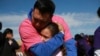 Families separated by US-Mexico border reunite for a few precious minutes