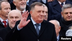 Bosnia's member of tripartite presidency Milorad Dodik waves to people during parade celebrations to mark their autonomous Serb Republic's national holiday, in Banja Luka