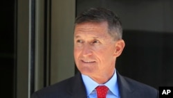 FILE - Former Trump national security adviser Michael Flynn leaves the federal courthouse in Washington, following a status hearing, July 10, 2018.