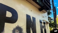 Enpak yon bal sou yon machin blende Polis Nasyonal Ayiti (PNH) nan Potoprens, Ayiti, Samdi 21 Janvye 2023.