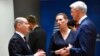 Germany's Chancellor Olaf Scholz, left, speaks with Latvia's Prime Minister Krisjanis Karins, right, and Denmark's Prime Minister Mette Frederiksen at an EU summit in Brussels, Oct. 21, 2022.