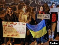 FILE - Activists protest against Iran allegedly supplying drones to Russia, in front of the Iranian embassy after a Russian drone strike in the morning, which local authorities consider to be Iranian-made unmanned aerial vehicles (UAVs) Shahed-136, amid Russia's attack on Ukraine, in Kyiv, Ukraine, Oct. 17, 2022.