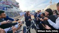 U. S. Vice President Kamala Harris speaks with reporters after visiting the USS Howard naval destroyer at Yokosuka Naval Base outside Tokyo, Sept. 28, 2022.