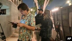 FILE - Jorge Xolalpa, 33, a Mexican-born filmmaker, foreground, directs his latest movie in San Pedro, Calif., Oct. 12, 2022. Xolalpa is among hundreds of thousands of people waiting to learn if the program known as Deferred Action for Childhood Arrivals will be allowed to continue.