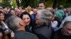 Protesters kiss opposition candidate Jelena Trivic during protest against alleged election fraud in a general elections in the Bosnian town of Banja Luka, 240 kms northwest of Sarajevo, Oct. 6, 2022.