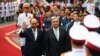 United Nations Secretary General Antonio Guterres (centre R) and Vietnam's President Nguyen Xuan Phuc (centre L) walk during a welcome ceremony at the Presidential Palace in Hanoi on October 21, 2022. (Photo by Nhac NGUYEN / AFP)