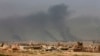 Smoke rises after an airstrike by U.S.-led coalition warplanes during fighting on the western side of Mosul, Iraq, Feb. 27. 2017. A senior Iraqi police commander said Monday that troops have taken control of the western side of a key bridge in Mosu.