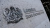 FILE - Signage is seen outside the entrance of the London Stock Exchange, in London, Britain. Aug 23, 2018.