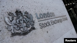 FILE - Signage is seen outside the entrance of the London Stock Exchange, in London, Britain. Aug 23, 2018.