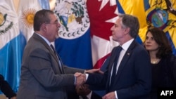Guatemalan President Bernardo Arevalo, left, shakes hands with U.S. Secretary of State Antony Blinken during the Los Angeles Declaration on Migration and Protection ministerial meeting in Guatemala City on May 7, 2024.