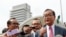 FILE - Cambodia's exiled opposition leader Sam Rainsy talks to the media outside Parliament House in Kuala Lumpur, Malaysia, Tuesday, Nov. 12, 2019. (AP Photo/Vincent Thian)