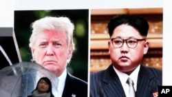 东京街头显示川普和金正恩的巨大屏幕(美联社)