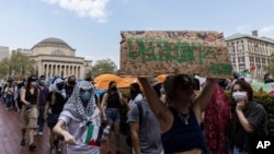 Student protesters march around their encampment on the Columbia University campus, April 29, 2024, in New York. Student protests over the Israel-Hamas war have popped up at many college campuses following the arrest of demonstrators this month at Columbia University. 