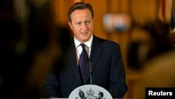 Britain's Prime Minister David Cameron makes a statement to the media following the killing of British aid worker David Haines, at Number 10 Downing Street in London September 14, 2014.