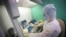 A medical staffer works with test systems for the diagnosis of coronavirus, at the Krasnodar Center for Hygiene and Epidemiology microbiology lab in Krasnodar, Russia, Feb. 4, 2020.