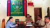 Deputy police chief Sithong Sokha meets with Stung Treng police officials after she posted a photo of herself breastfeeding her child while on the job. (Courtesy photo)