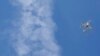 FILE - Increasingly, drones are being used to monitor weather patterns and help map out contours of the land.