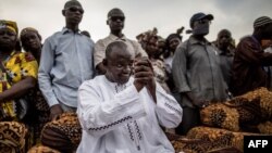 Adama Barrow, the flag-bearer of the coalition of the seven opposition political parties in Gambia, greets supporters during a gathering in the Buffer Zone district of Talinding, Nov. 29, 2016, on the last day of the presidential campaign in Gambia.