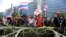 Anti-government protesters chant slogans during a rally outside the office of the permanent secretary for defense where Prime Minister Yingluck Shinawatra was reportedly working inside, Monday, Feb. 3, 2014.