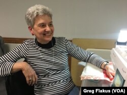 Linda Ebersole, of Rock Falls, Ill., takes a break from her weeking sewing gathering at the Fulton Community Center in Fulton, Ill.