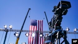 FILE - A news camera is set up at an election campaign rally in Old Forge, Pennsylvania, Aug. 20, 2020.