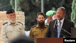 Israeli Security Minister Itamar Ben-Gvir speaks at a memorial ceremony marking Israel's Memorial Day, when the country commemorates fallen soldiers of Israel's wars and Israeli victims of militant attacks, in Beersheba, Israel, April 25, 2023. REUTERS/Nir Elias