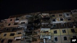 A damaged apartment building is seen after a Russian attack at a residential area in Kryvyi Rih, Ukraine, March 13, 2024. At least three people were killed and dozens more were wounded as the result of a Russian missile strike on President Volodymyr Zelenskyy's hometown.