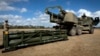 In this image provided by the U.S. Army, a soldier prepares the crane for loading the Army Tactical Missile System on to the High Mobility Artillery Rocket System (HIMARS) on July 26, 2023. Ukraine would like the option to use HIMARS in Russian territory.