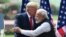 FILE - President Donald Trump shakes hands with India's Prime Minister Narendra Modi during a joint press conference at Hyderabad House in New Delhi, Feb. 25, 2020.