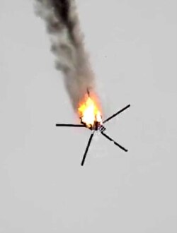 A screen grab taken from a video published by jihadists of the Hayat Tahrir al-Sham allegedly shows a Syrian military helicopter being downed, Feb. 12, 2020, in Syria's war-torn province of Idlib.