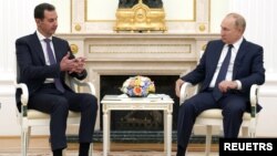 Presiden Rusia Vladimir Putin dan Presiden Suriah Bashar al-Assad di Kremlin, Moskow, Rusia, 13 September 2021. (Sputnik/Mikhail Klimentyev/Kremlin via REUTERS)