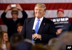 Republican presidential candidate Donald Trump smiles as he speaks at a campaign stop Tuesday, March 29, 2016.