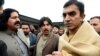FILE - In this Jan. 27, 2020, photo, leaders of the Pashtun Tahafuz (Protection) Movement or (PTM), Mohsin Dawar, right, and Ali Wazir, left, protest the arrest of their leader in Islamabad, Pakistan.