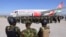 FILE - Kenyan police officers arrive at the Toussaint Louverture International Airport in Port-au-Prince, Haiti, as part of a peace-keeping mission to tackle violence in Haiti, Jan. 18, 2025. 