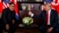 Presiden AS, Donald Trump, melakukan pertemuan dengan Pemimpin Korut, Kim Jong Un, di Sentosa Island, Singapura, Selasa 12 Juni 2018 (foto: AP Photo/Evan Vucci).