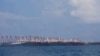 In this photo released March 21, 2021, by the Philippine Coast Guard/National Task Force-West Philippine Sea, some of the 220 Chinese vessels are seen moored at the Whitsun reef, South China Sea, March 7, 2021. 