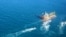 A picture obtained by AFP from the Iranian news agency Tasnim on Jan. 4, 2021, shows the South Korean-flagged tanker being escorted by Iran's Revolutionary Guards navy after being seized in the Gulf.