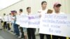 Security guards, terminated over allegations of sharing child pornography, and members of their families, protest in front of the U.S. Embassy in Phnom Penh, Cambodia, June 19 2018. (T. Malis/VOA Khmer) 