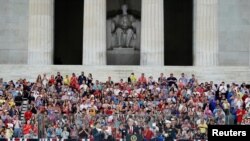 President Donald Trump and first lady Melania Trump arrive at an Independence Day celebration in front of the Lincoln Memorial in Washington, July 4, 2019. 
